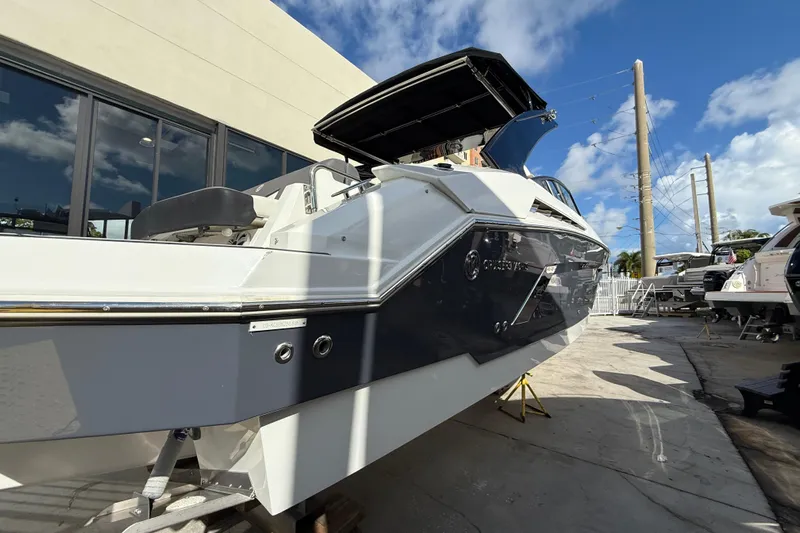  Yacht Photos Pics 2019 Cruisers Yachts 338 Outboard, docked under a clear blue sky.