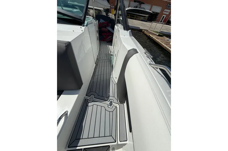  Yacht Photos Pics 2019 Cruisers Yachts 338 Outboard deck with sleek seating and modern flooring.