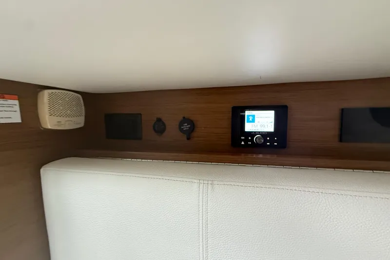  Yacht Photos Pics Interior of 2019 Cruisers Yachts 338 Outboard featuring audio controls and speaker system.