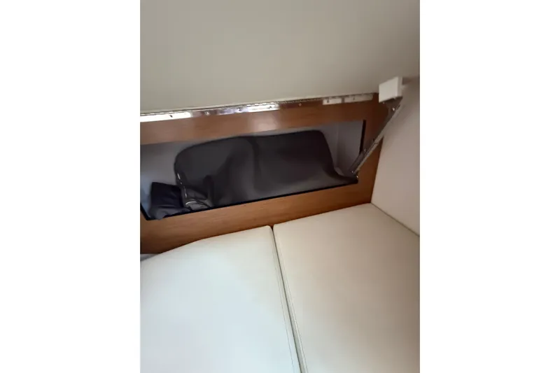  Yacht Photos Pics 2019 Cruisers Yachts 338 Outboard interior storage compartment with cushion seating.