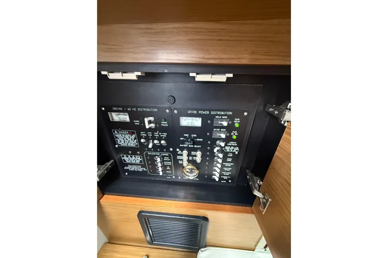  Yacht Photos Pics Electrical panel inside 2019 Cruisers Yachts 338 Outboard, showcasing power distribution controls.