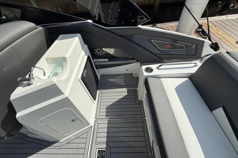  Yacht Photos Pics 2019 Cruisers Yachts 338 Outboard interior with sink, seating, and modern design.