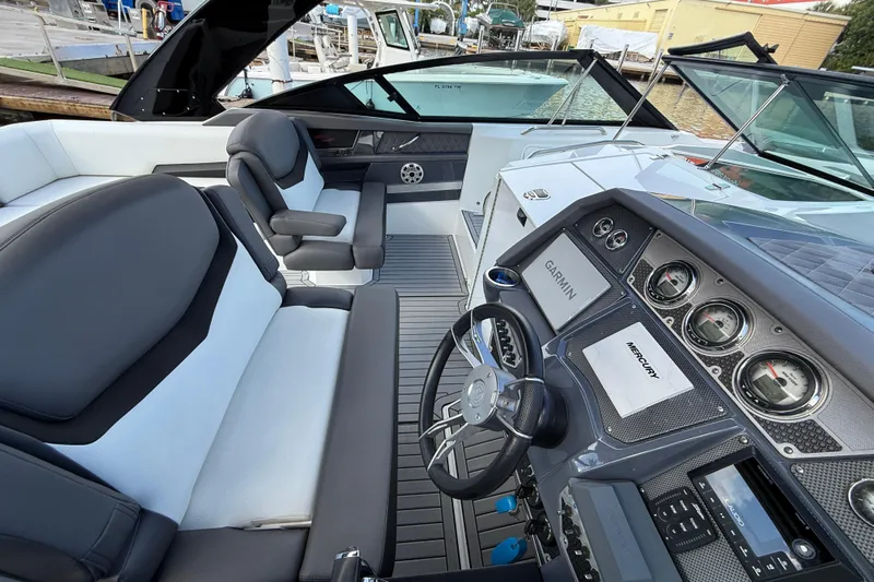  Yacht Photos Pics 2019 Cruisers Yachts 338 Outboard cockpit with Garmin and Mercury controls, luxurious seating.