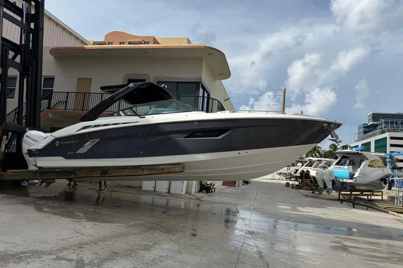  Yacht Photos Pics 2019 Cruisers Yachts 338 Outboard on lift at marina, ready for launch.