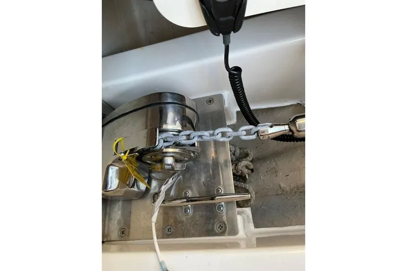  Yacht Photos Pics Anchor windlass system on 2023 Pursuit S 358 Sport boat, featuring chain and rope.