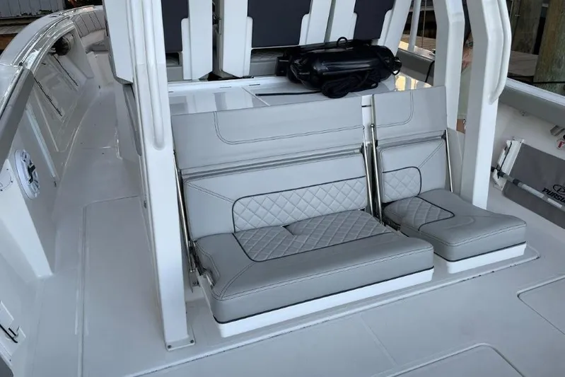  Yacht Photos Pics 2023 Pursuit S 358 Sport boat interior with stylish gray seating and modern design.