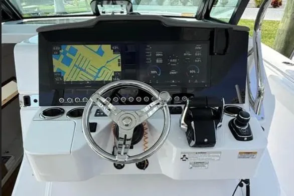  Yacht Photos Pics 2024 Bertram 39 CC helm with advanced navigation display and controls.