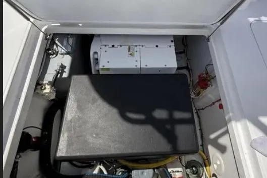  Yacht Photos Pics 2024 Bertram 39 CC engine compartment with equipment and wiring.