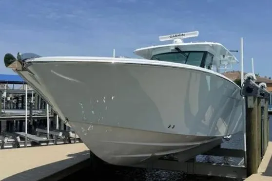  Yacht Photos Pics 2024 Bertram 39 CC boat docked, showcasing sleek design and modern features.