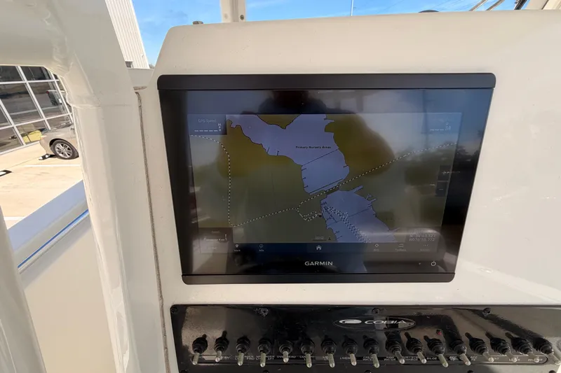  Yacht Photos Pics 2024 Cobia 262 Center Console with Garmin navigation display showing map.