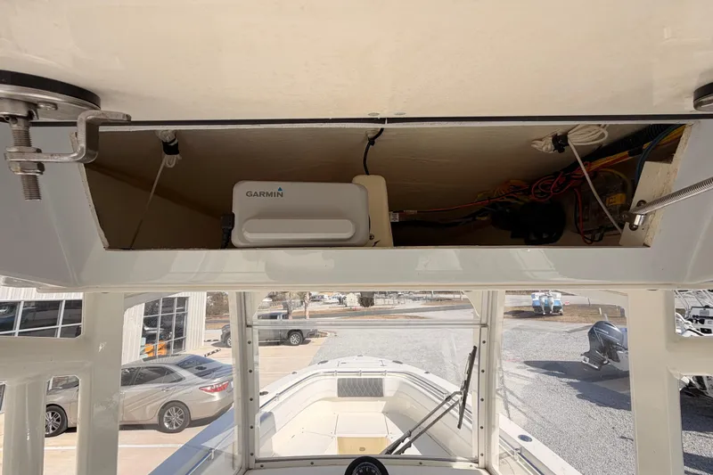  Yacht Photos Pics 2024 Cobia 262 Center Console boat with Garmin electronics and open storage compartment.