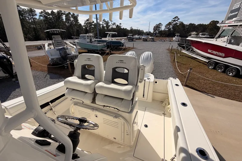  Yacht Photos Pics 2024 Cobia 262 Center Console boat interior with dual seats and steering wheel.