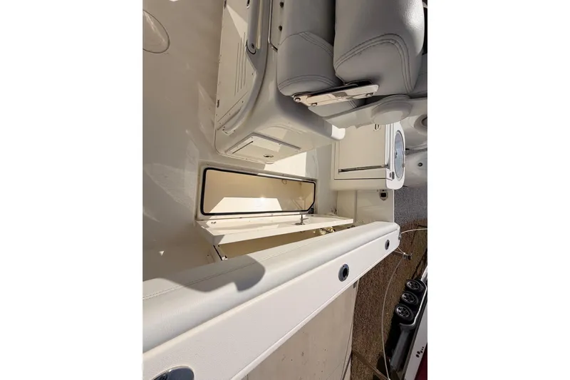  Yacht Photos Pics 2024 Cobia 262 Center Console boat interior with seating and storage compartments.