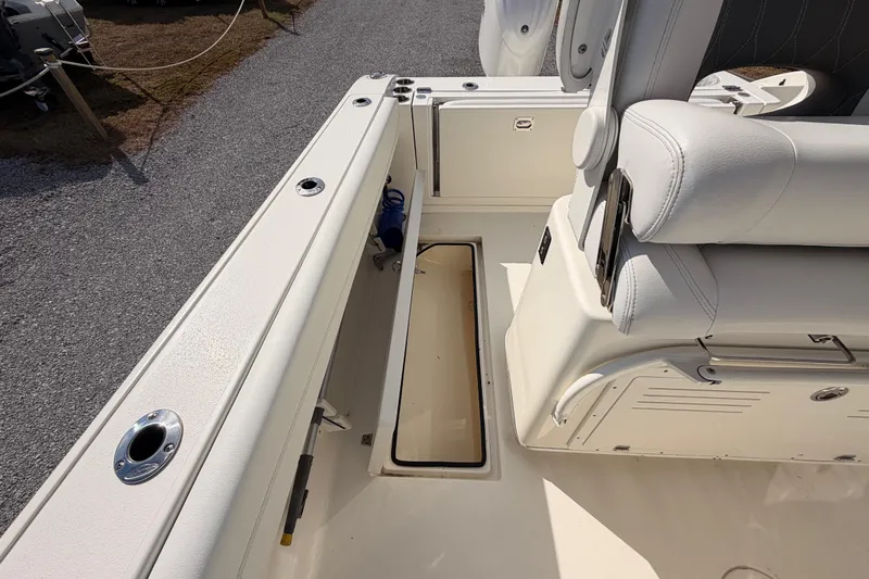  Yacht Photos Pics 2024 Cobia 262 Center Console boat interior with storage compartment and seating.