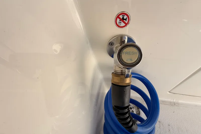  Yacht Photos Pics Freshwater hose connection on 2024 Cobia 262 Center Console boat.