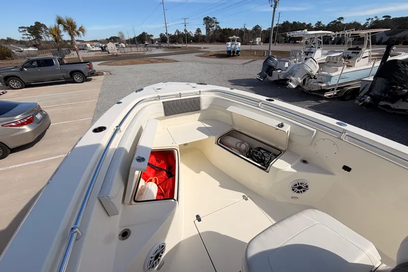  Yacht Photos Pics 2024 Cobia 262 Center Console boat interior with storage compartments and seating.