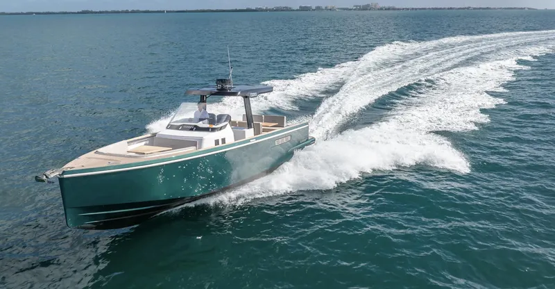  Yacht Photos Pics 2023 Fjord 38 yacht cruising swiftly on open water.