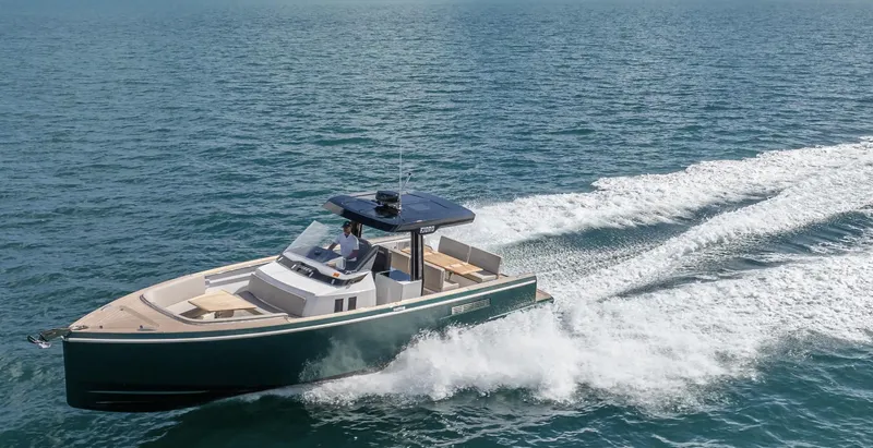  Yacht Photos Pics 2023 Fjord 38 boat cruising on open water, showcasing sleek design and powerful performance.