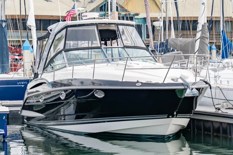 Memory Maker Yacht Photos Pics 2013 Monterey 340 Sport Yacht docked in marina, sleek black and white design.
