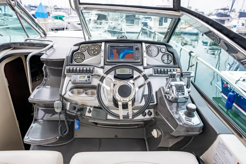 Memory Maker Yacht Photos Pics Cockpit of 2013 Monterey 340 Sport Yacht with modern navigation controls and steering wheel.