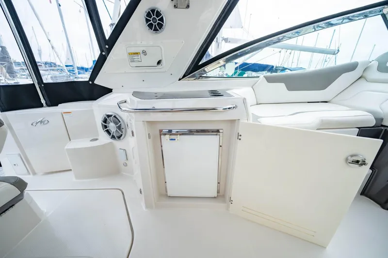 Memory Maker Yacht Photos Pics Interior of 2013 Monterey 340 Sport Yacht with seating and storage area.