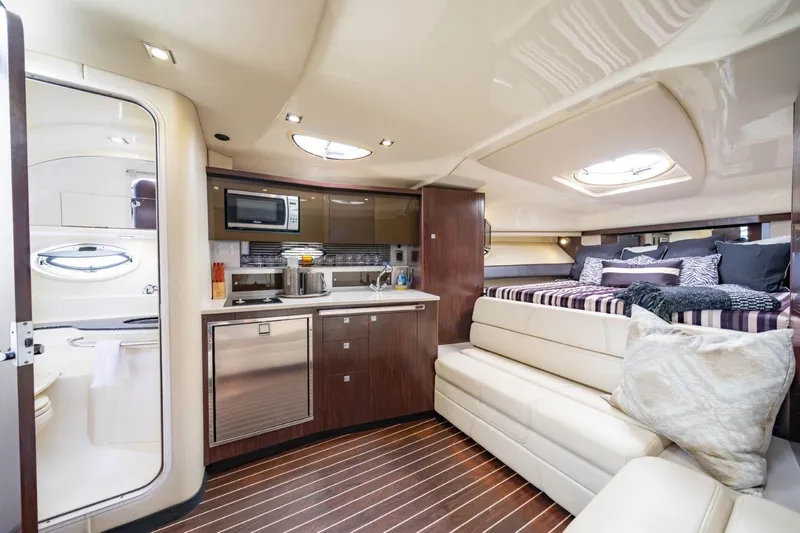 Memory Maker Yacht Photos Pics Luxurious interior of 2013 Monterey 340 Sport Yacht with modern kitchen and cozy seating.