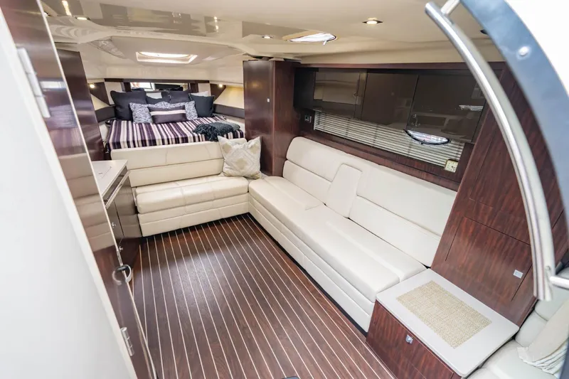 Memory Maker Yacht Photos Pics Luxurious interior of 2013 Monterey 340 Sport Yacht with elegant seating and cozy bedroom.