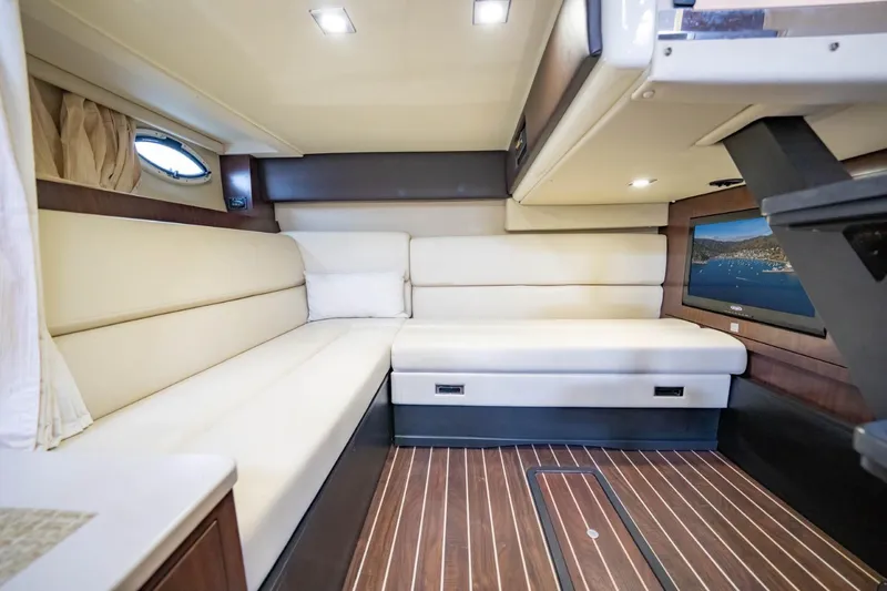 Memory Maker Yacht Photos Pics Luxurious interior of 2013 Monterey 340 Sport Yacht with plush seating and modern amenities.