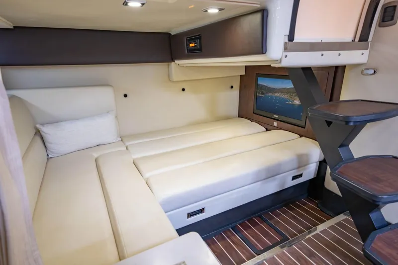 Memory Maker Yacht Photos Pics Luxurious interior of 2013 Monterey 340 Sport Yacht with cozy seating and modern amenities.