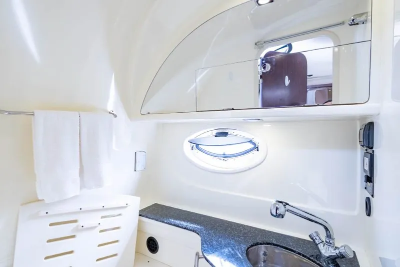 Memory Maker Yacht Photos Pics 2013 Monterey 340 Sport Yacht bathroom with sink, mirror, and towel rack.