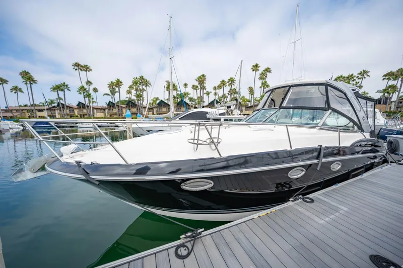 Memory Maker Yacht Photos Pics 2013 Monterey 340 Sport Yacht docked in a marina with palm trees.