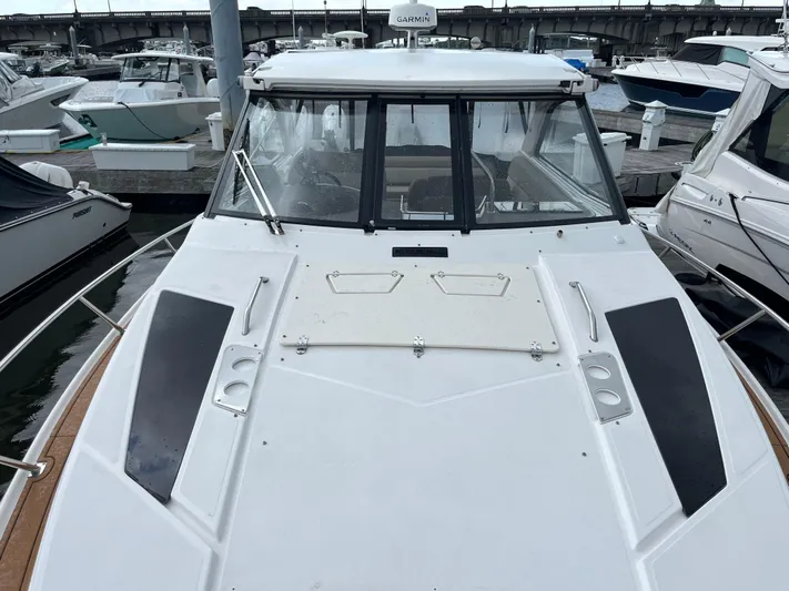  Yacht Photos Pics 2014 Regal 35 Sport Coupe docked at marina, front deck view.