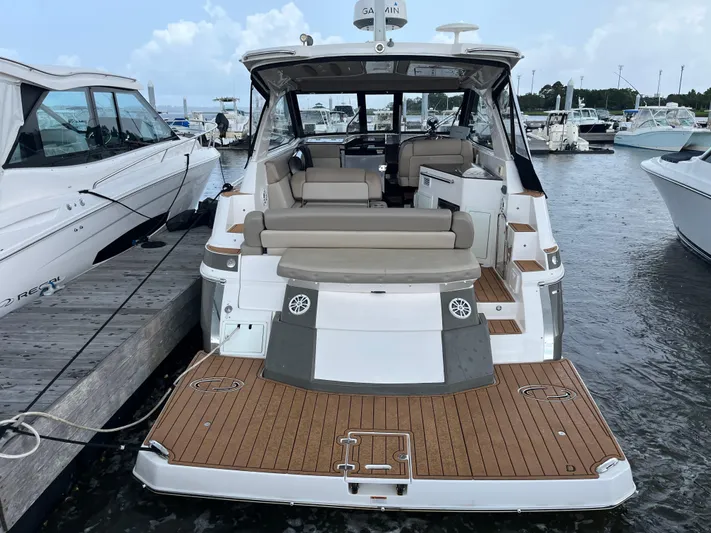  Yacht Photos Pics 2014 Regal 35 Sport Coupe docked, showcasing spacious deck and seating area.
