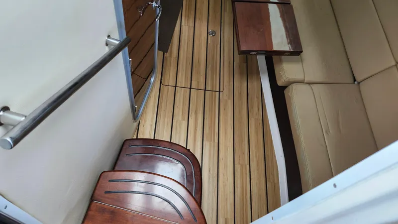  Yacht Photos Pics 2014 Regal 35 Sport Coupe interior with wooden flooring and beige seating.