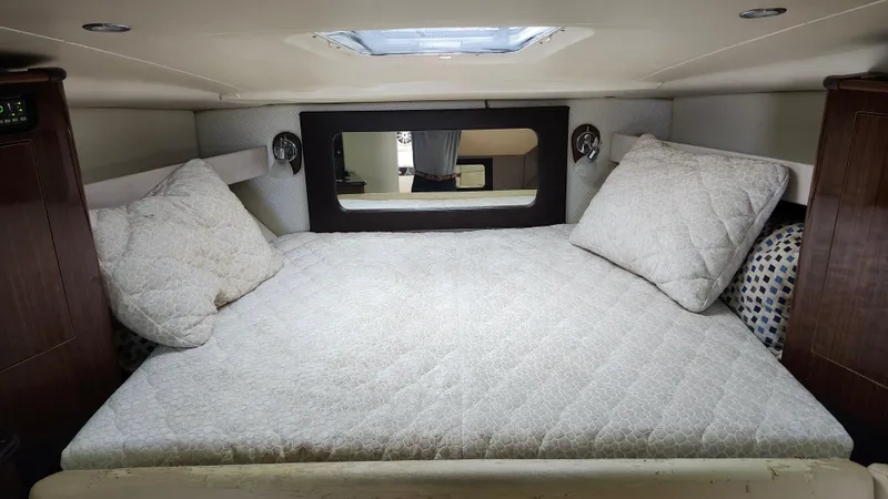  Yacht Photos Pics Cozy cabin interior of 2014 Regal 35 Sport Coupe with comfortable bedding and modern design.