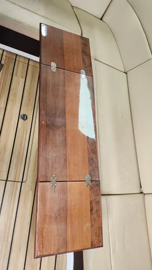  Yacht Photos Pics Wooden table with hinges on a Regal 35 Sport Coupe 2014 boat interior.