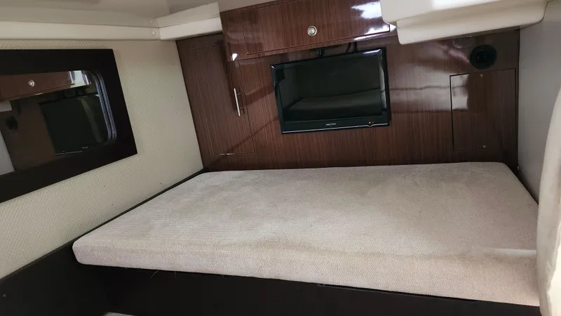  Yacht Photos Pics 2014 Regal 35 Sport Coupe interior cabin with bed and TV.