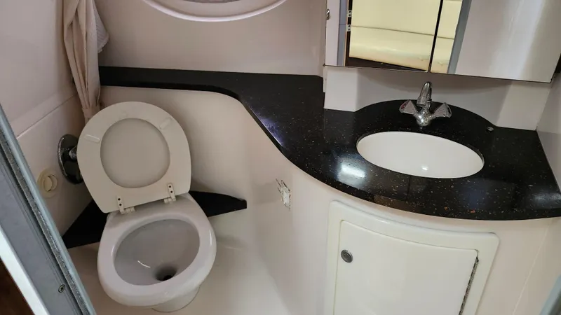  Yacht Photos Pics Bathroom interior of 2014 Regal 35 Sport Coupe with toilet and sink.