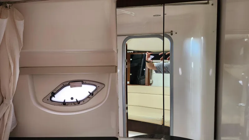  Yacht Photos Pics Interior of 2014 Regal 35 Sport Coupe with mirror and porthole window.
