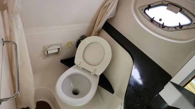  Yacht Photos Pics Bathroom interior of 2014 Regal 35 Sport Coupe with toilet and porthole window.