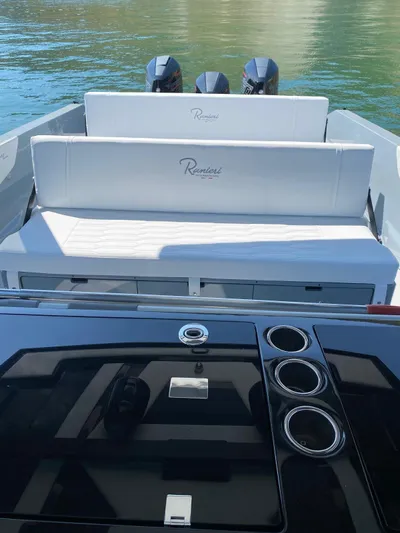  Yacht Photos Pics 2023 Cayman Yachts 45.0 Cruiser with sleek seating and modern design on calm water.