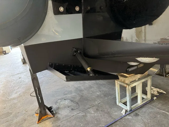  Yacht Photos Pics 2023 Cayman Yachts 45.0 Cruiser under maintenance in a workshop.