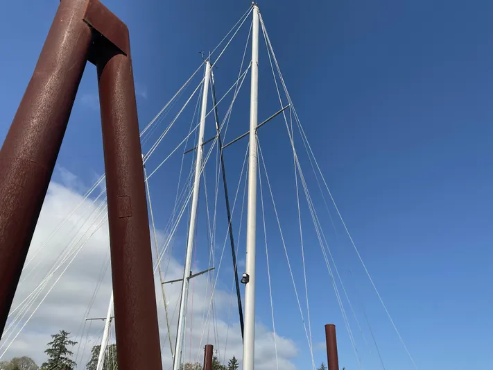  Yacht Photos Pics Masts of 1980 Kanter Staysail Cutter against clear blue sky.
