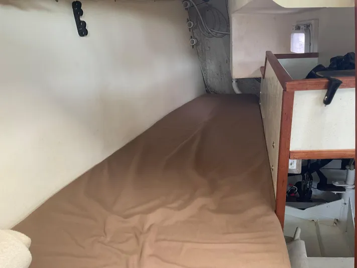  Yacht Photos Pics Interior of 1980 Kanter Staysail Cutter with a cozy sleeping berth.