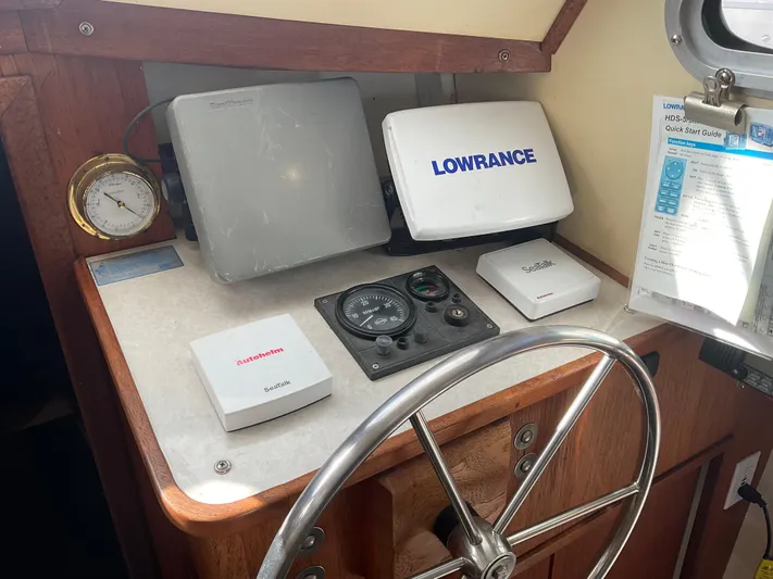  Yacht Photos Pics 1980 Kanter Staysail Cutter helm with navigation equipment and steering wheel.