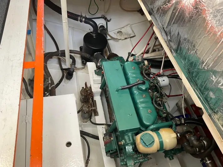  Yacht Photos Pics Engine compartment of a 1980 Kanter Staysail Cutter, featuring a green marine engine.