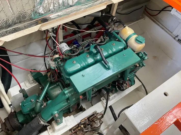  Yacht Photos Pics Engine compartment of a 1980 Kanter Staysail Cutter, showcasing a well-maintained marine engine.