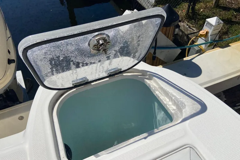  Yacht Photos Pics Open hatch on 2011 Boston Whaler 320 Outrage boat, revealing storage compartment.
