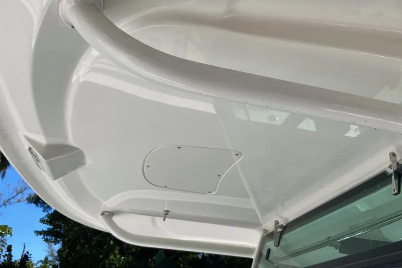  Yacht Photos Pics 2011 Boston Whaler 320 Outrage boat canopy detail with clear sky background.