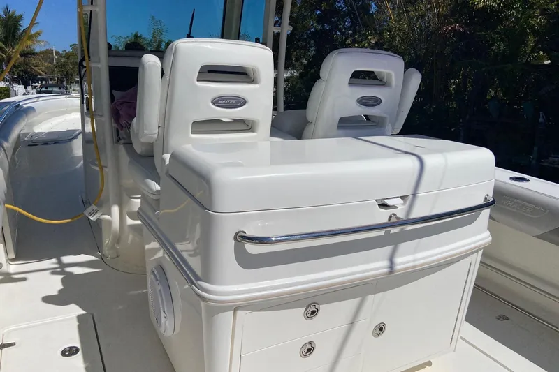  Yacht Photos Pics 2011 Boston Whaler 320 Outrage boat interior with seating and storage compartments.